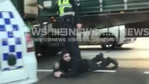 Video obtained exclusively by 9NEWS shows the moment police detained the men. Picture: 9NEWS