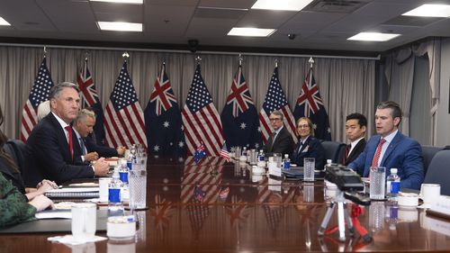 Secretary of Defense Pete Hegseth, right, welcomes Australian Deputy Prime Minister and Defense Minister Richard Marles, left, before the start of their meeting at the Pentagon, Friday, Feb. 7, 2025, in Washington. (AP Photo/Manuel Balce Ceneta)