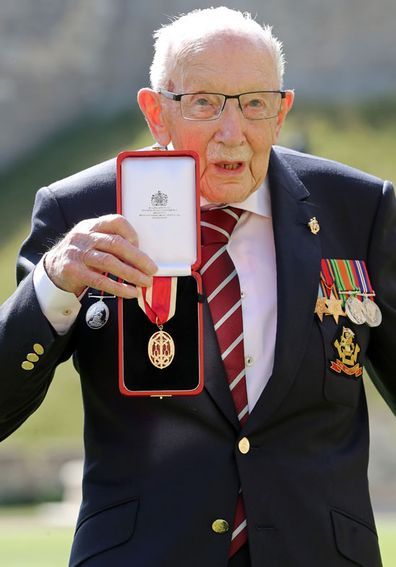 Captain Sir Thomas Moore poses after being awarded with the insignia of Knight Bachelor by Queen Elizabeth II at Windsor Castle on July 17, 2020 in Windsor, England. 