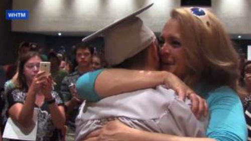 US high school students recreate graduation for classmate released from coma after car crash