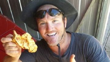 Mck Brown with his nugget, which he has nicknamed the 'fair dinkum' nugget.
