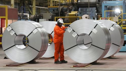 A steel worker works at the ArcelorMittal Dofasco steel plant in Hamilton, Ont., on Wednesday, March 12, 2025. (Nathan Denette /The Canadian Press via AP)