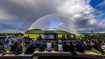 Pride month sign as rainbow sits over Wimbledon