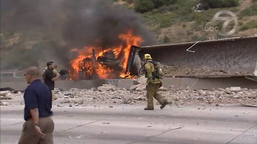  National guardsmen happened to be driving past and helped rescue the drivers and a passenger (9NEWS)