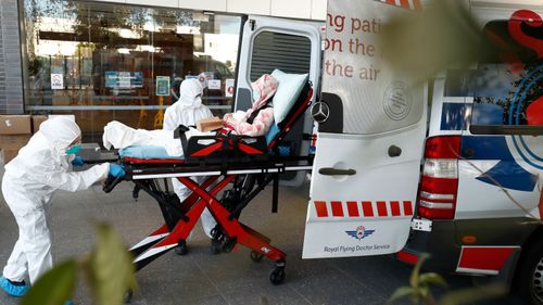 A resident of Epping Gardens Aged Care Facility, where there is a coronavirus outbreak, is taken away in an ambulance today.