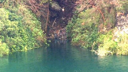 The man's car was fond submerged in the lake. There is fear it leaked into the drinking supply. Picture: 9NEWS