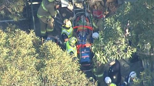 Emergency services free injured man after Sydney wall collapse