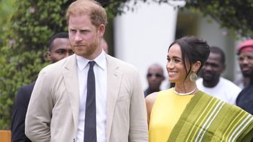 Prince Harry, left, and Meghan, right, holding hands upon arrival at the government house in Lagos Nigeria, Sunday, May 12, 2024. Prince Harry and his wife Meghan are in Nigeria to champion the Invictus Games, which Prince Harry founded to aid the rehabilitation of wounded and sick servicemembers and veterans. 