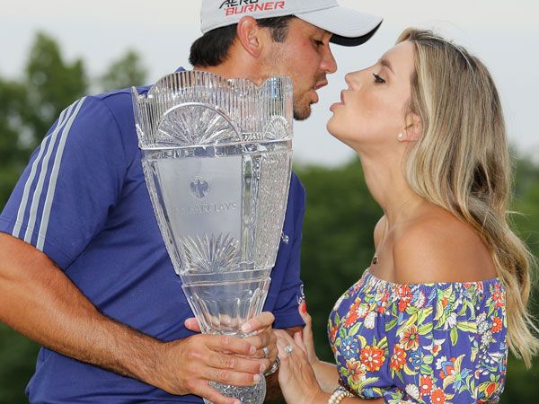 Jason Day kisses his wife after receiving the Barclays trophy. (AFP)