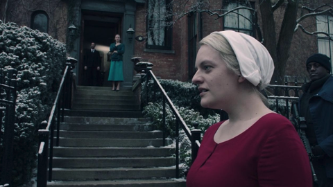 Elisabeth Moss as June Osborne filming a scene outside the Hamilton mansion in the TV series, The Handmaid's Tale.