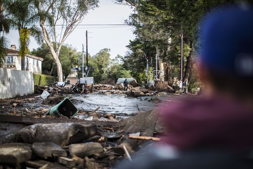 Anxious family members await word on loved ones as rescue crews searched grimy debris and ruins for the 17 people who remain missing. (AAP)