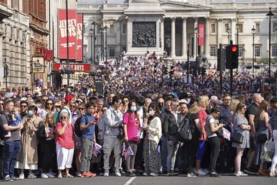 Crowds gather near Trafalgar Square in London.