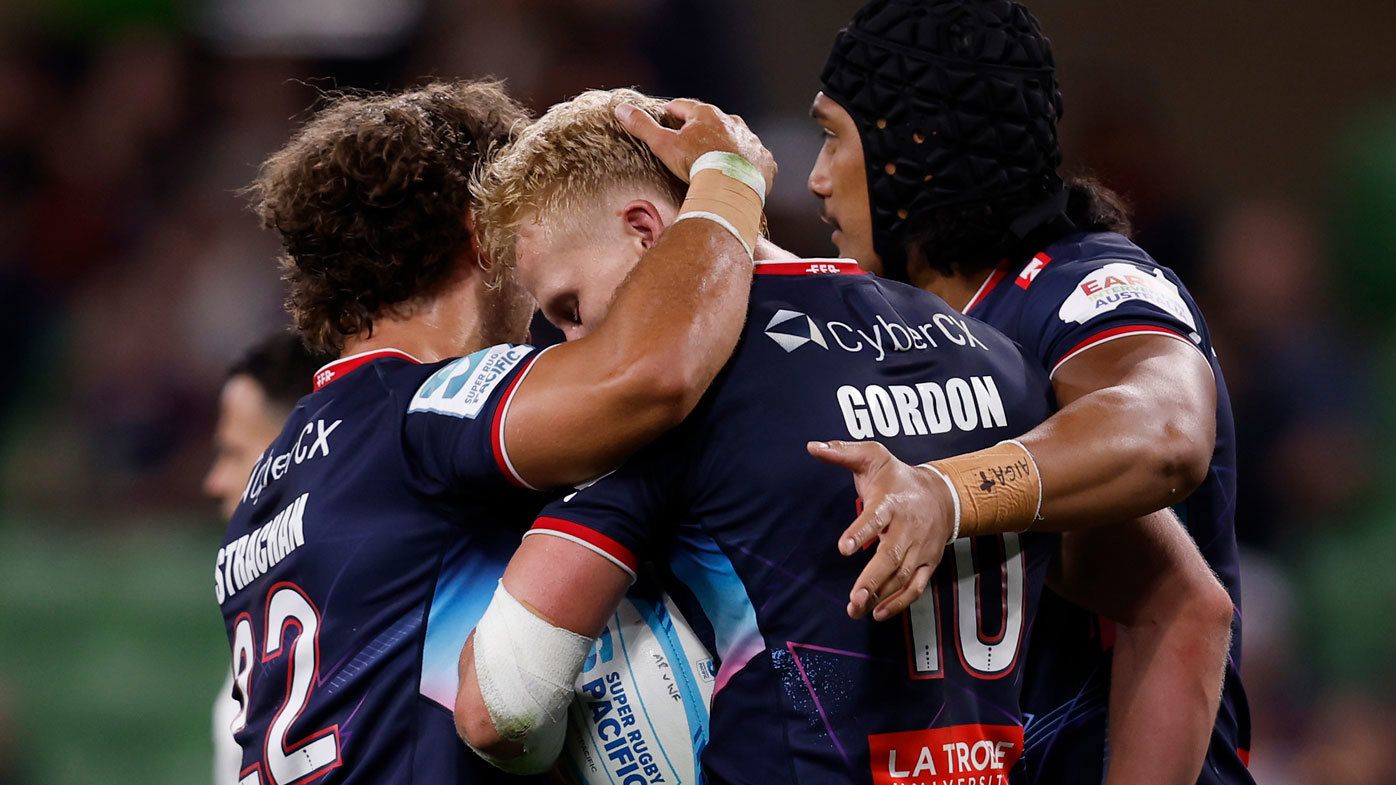 Melbourne Rebels players celebrate a try against the Western Force.