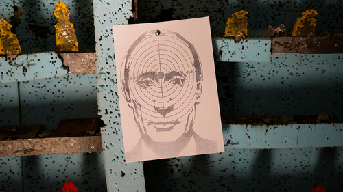 A picture of Russian President Vladimir Putin hangs at a target practice range in Lviv, western Ukraine, Thursday, March 17, 2022.