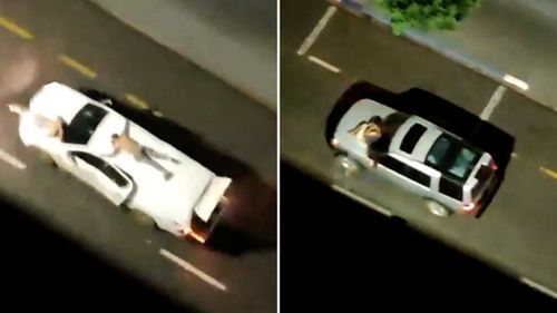 Hostages are strapped to the roofs and bonnets of getaway cars during the robbery in Brazil.
