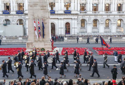 Some of the 10,000 British veterans who marched through London streets after the ceremony.