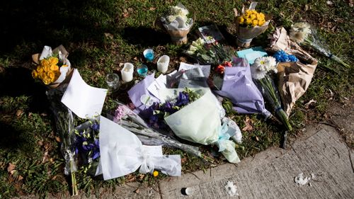 Flowers and candles outside the house where Jack and Jennifer Edwards were murdered by their father in West Pennant Hills.