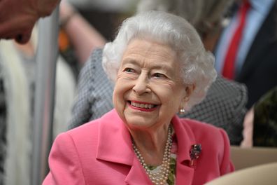 Queen Elizabeth II is given a tour during a visit to The Chelsea Flower Show 2022 at the Royal Hospital Chelsea on May 23, 2022 in London, England. 