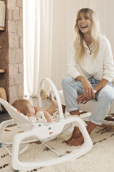 Elyse Knowles with baby Sunny in the Fisher Price Rocker. 