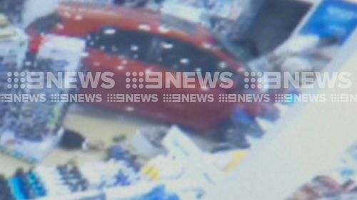 Pharmacist was hit and pinned down by the vehicle. (9NEWS)