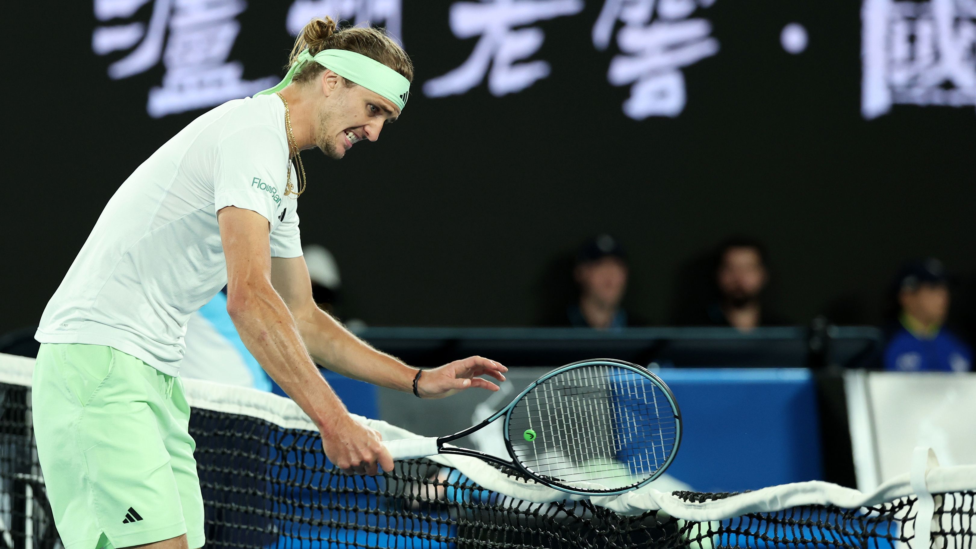 MELBOURNE, AUSTRALIA - JANUARY 26: Alexander Zverev of Germany hits the net with his racquet in their Semifinal singles match against Daniil Medvedev during the 2024 Australian Open at Melbourne Park on January 26, 2024 in Melbourne, Australia. (Photo by Cameron Spencer/Getty Images)