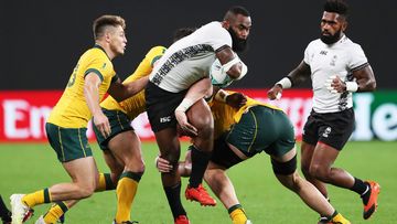 Semi Radradra of Fiji is tackled by Wallabies players in 2019.