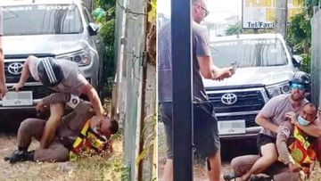 Two New Zealand men have been arrested after injuring a traffic officer and trying to grab his pistol in Phuket, police in Thailand say.