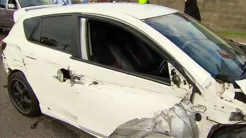 The man crashed into three other cars before he fled on foot. (9NEWS)