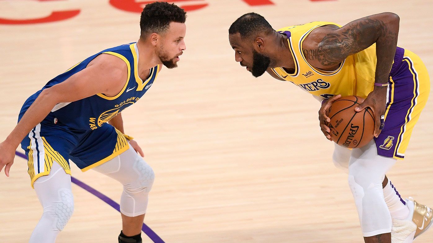 LeBron James #23 of the Los Angeles Lakers is guarded by Stephen Curry #30 of the Golden State Warriors during the first half at Staples Center on January 18, 2021 in Los Angeles, California. NOTE TO USER: User expressly acknowledges and agrees that, by downloading and/or using this Photograph, user is consenting to the terms and conditions of the Getty Images License Agreement. Mandatory Copyright Notice: Copyright 2021 NBAE (Photo by Harry How/Getty Images)