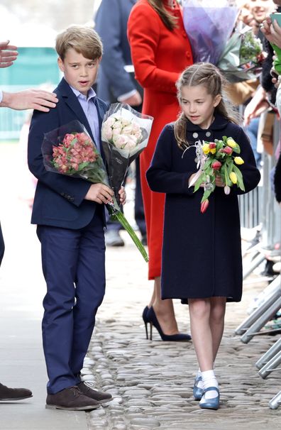 Prince George of Cambridge and Princess Charlotte of Cambridge hold bouquets of flowers during a visit to Cardiff Castle on June 04, 2022 in Cardiff, Wales. 