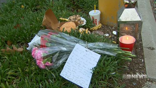 Flowers and notes from devastated community members were left at the scene. (9NEWS)