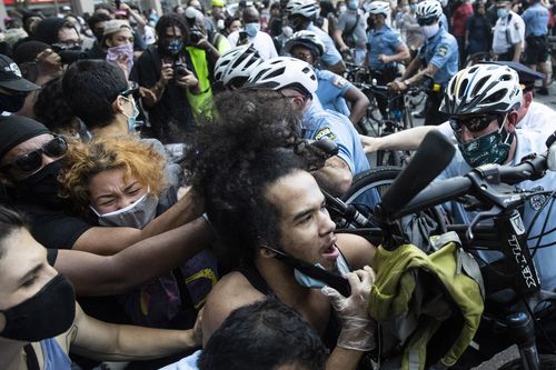 Police and protesters clash in Philadelphia during a demonstration over the death of George Floyd.