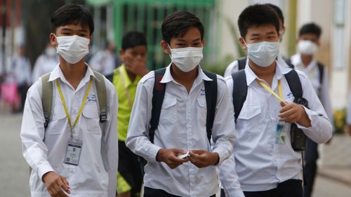 Students wear masks to avoid the contact of coronavirus at a high school in Phnom Penh, Cambodia.