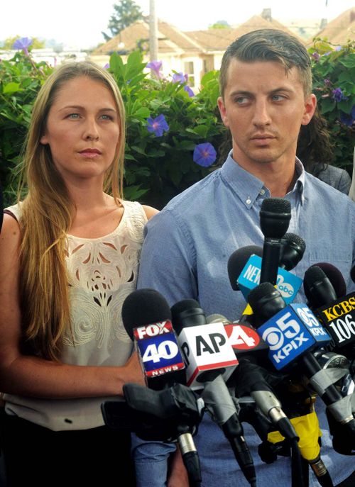 Denise Huskins and her boyfriend Aaron Quinn listen as their attorneys speak at a news conference in Vallejo, California in July 13, 2015. (AP)