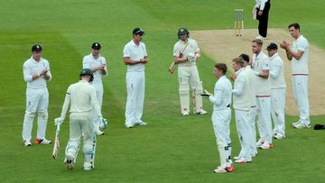 The English cricket team gives Australia captain MIchael Clarke a guard of honour as he walks to the crease at the Oval.