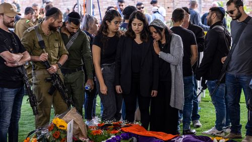 Friends and family mourn during a funeral for Staff Sergeant Major Constantine Sushko on January 01, 2024 in Tel Aviv, Israel. According the Israel Defense Forces, Sushko, who served in the Golani Brigade's 7086 Combat Engineering Battalion, was killed while fighting in Gaza on Saturday.