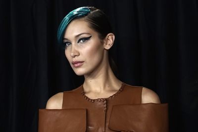 <p>Models of the moment Bella and Gigi Hadid, Kendall Jenner and Kaia Gerber have strutted down the Fendi runway and debuted killer new hair colour.</p>
<p>All four of the women sported nearly identical side-swept bangs in the boldest hues and the result was super sophisticated and seriously cool. The quartet all professed to love the look - Bella especially so. Indeed, she took one look at herself and broke into a broad grin. Given she's famed for her poker-faced expression, that's saying something.</p>
<p>The look, created by stylist Sam McKnight, saw custom-made hair-pieces in shades of aqua blue (and occasionally sea green and even deep grey) attached to the side of each model's hair part. To maximise the bad-gal feel, the models wore graphic, winged liner in rich shades of blue-ish black.</p>
<p>Oh and there were clothes too. And they were almost as incredible as the beauty looks. Leather that draped and fell in exquisite shapes, handbags in edgy designs and soft, sheer feminine pieces that made the rock chick feel all the more appealing.</p>
<p>Click through and see all that and more - including Bella with one big-ass smile. Frankly, it's not to be missed.</p>