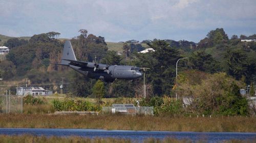 A Defence Force Hercules lands at Hawke's Bay airport in Napier, bringing further supplies as personnel and volunteers continue work clearing debris from Cyclone Gabrielle across the region.