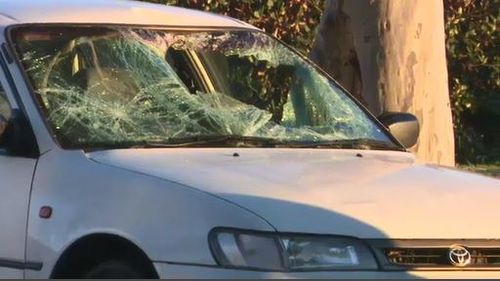 The white Toyota's windscreen was completely smashed in. Image: 9News