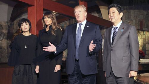 Donald Trump, his wife Melania, and Shinzo Abe and his wife Akie arrive at the Ginza Ukai Tei restaurant to have a dinner in Tokyo. (AAP)