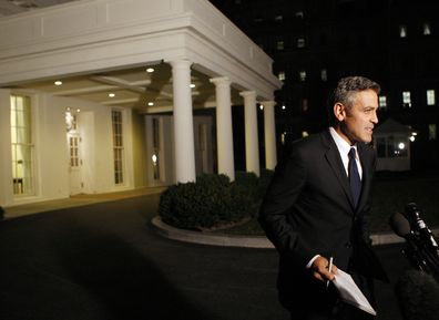 Actor George Clooney speaks to the media following a meeting at the White House in Washington, Feb. 23, 2009. 