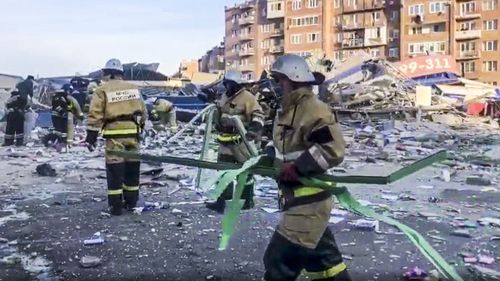 Russian Emergency Ministry employees work at a scene of a powerful explosion in Vladikavkaz, Russia, Friday, Feb. 12, 2021