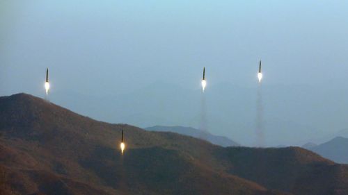 An undated file photo released by the North Korean Central News Agency on 7 March 2017 shows four projectiles during a ballistic rocket launching drill at an undisclosed location. (AAP)