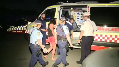 A policeman and a woman were injured at the scene. (9NEWS)