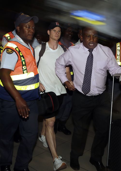 Steve Smith was booed as he was escorted through the airport to leave South Africa. (AAP)