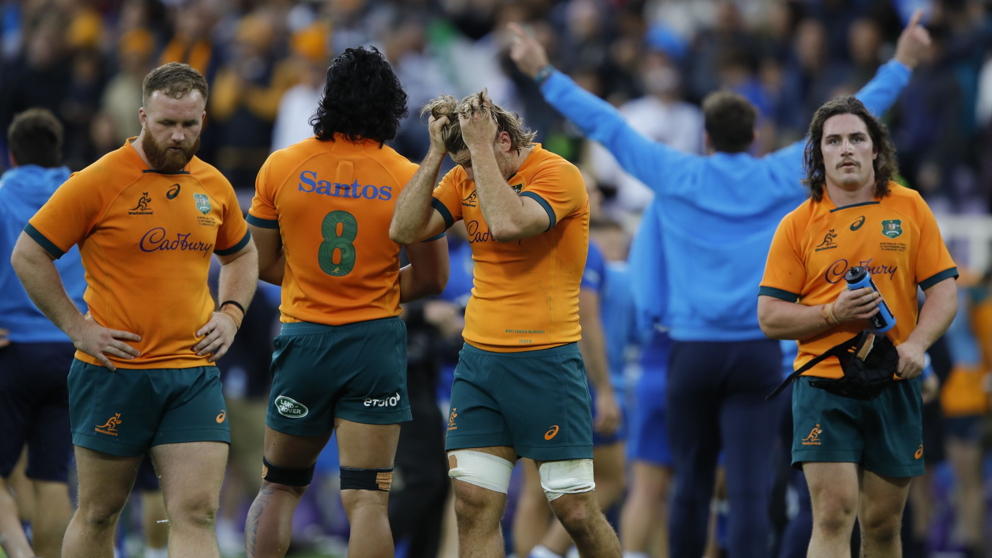 Australia react to the loss at Stadio Artemio Franchi.