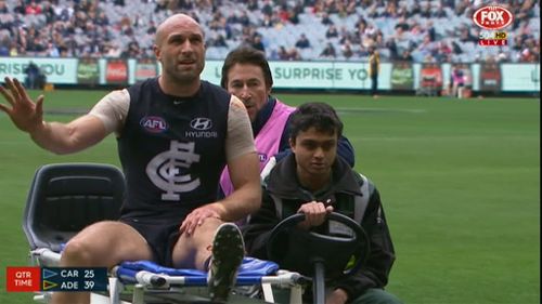 Judd is raced from the grounds. (9NEWS)