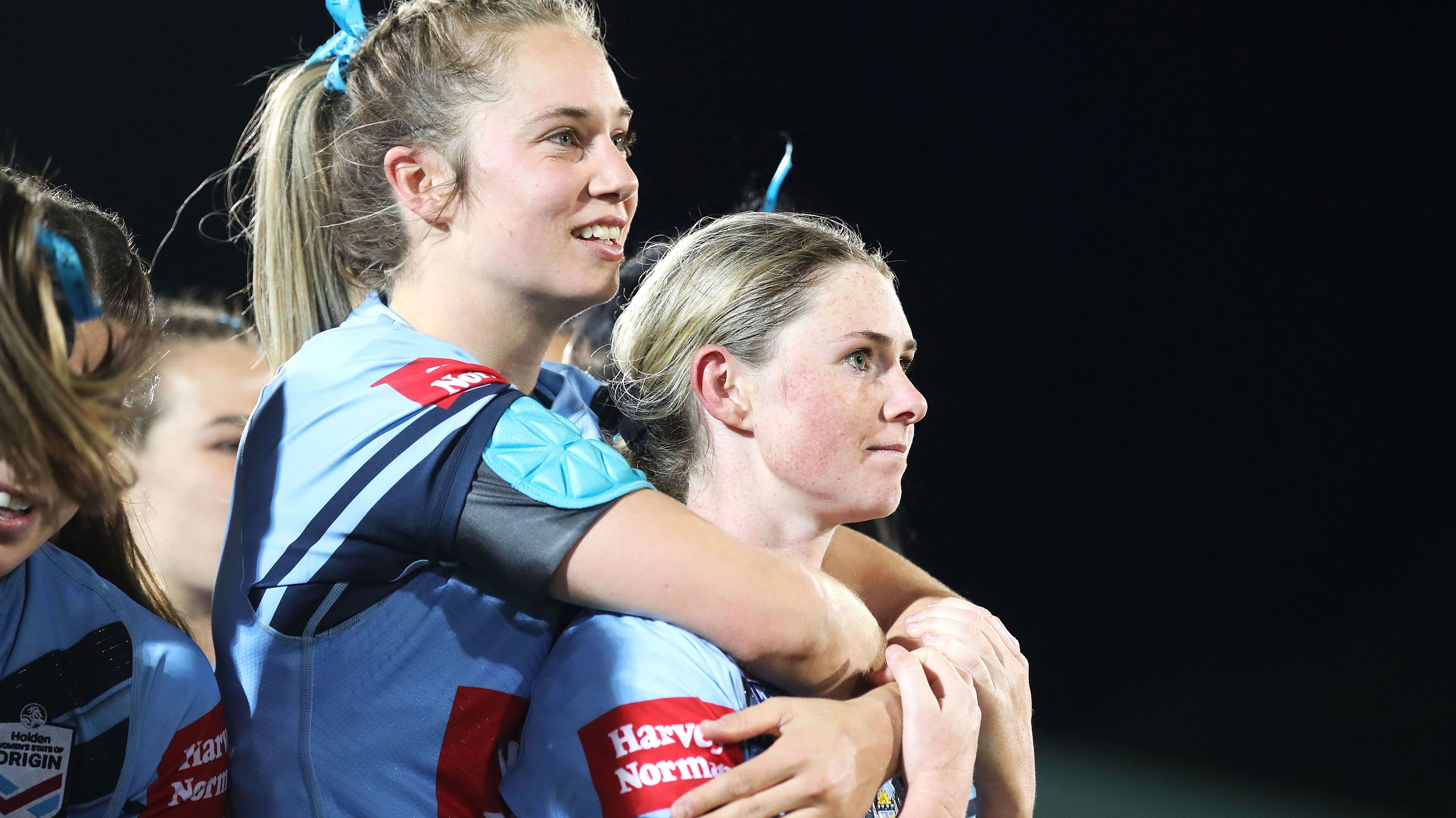Kezie Apps and Maddie Studdon of NSW watch on during the presentation after the Women&#x27;s State of Origin match in 2019.
