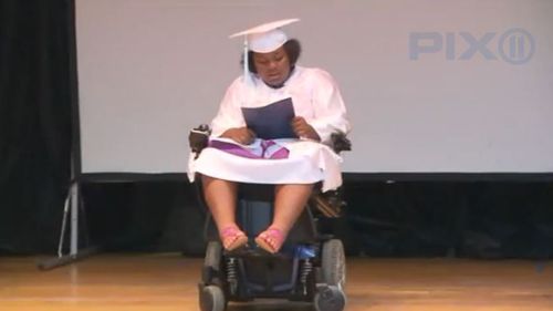 Teen shooting survivor receives standing ovation at grade eight graduation