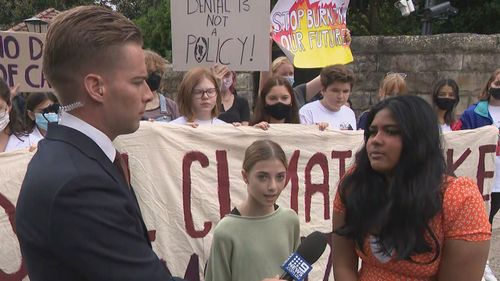 School children gather outside the Kirribilli house to call for climate action.